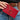 Adriana card holder red with a gold-tone ring detail held in hand.