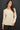 Model wearing cream raglan sleeve slub pullover sweater, front view