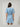 Back view of the Gabriella Denim Fray Mini Dress featuring fringe details and a relaxed fit.