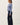 Side view of model wearing blue Ultra Soft Essential Basic Crewneck Button Up Cardigan with pants