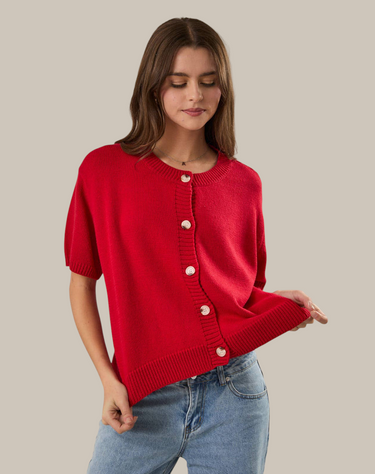 Model wearing red short sleeve sweater cardigan