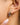 Staven 18K Gold Non-Tarnish Two Tone Crossover Earrings worn in ear, featuring sleek silver and gold design.