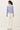 Back view of model wearing light blue Ultra Soft Boatneck Basic Long Sleeve Top