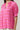 Mirany Ikat Bindy Puff Sleeve Top in fuchsia with puff sleeves, ruffle neckline, and smocked cuffs.