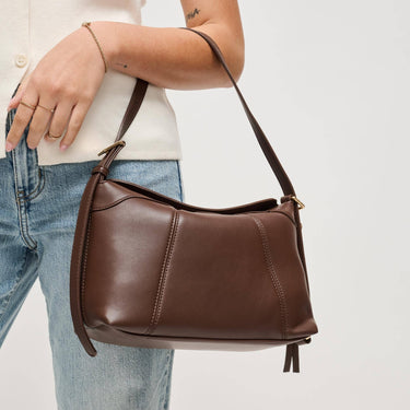 Waylon Shoulder Bag Chocolate carried over the shoulder, showcasing its rich brown color.