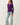 Side view of model wearing purple Ultra Soft Boatneck Basic Long Sleeve Top with blue jeans