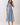 Embroidered Floral Tiered Button Down Midi Dress in blue with a collared neckline and tiered skirt on a model.