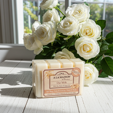 A La Maison Oat Milk Bar Soap Value Pack 4 x 3.5 oz bars on a floral background