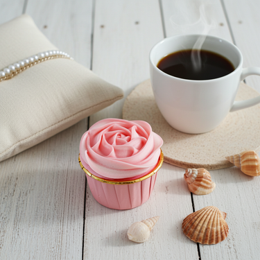 Rose Cupcake Soap pink cupcake-shaped soap displayed with coffee