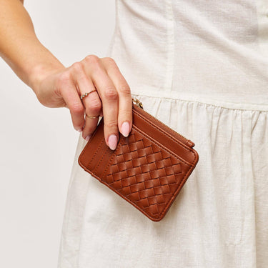 Bryer Card Holder Chocolate displayed in hand with a stylish leather-look finish.