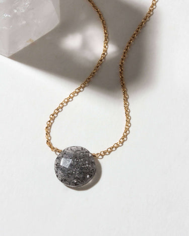 Gem in the Moon Gemstone Necklace- Black Sunstone with 14KT gold-plated chain and sparkling black sunstone pendant.