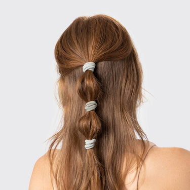 Eco-Friendly Nylon Elastics 20pc - Eucalyptus used in a stylish hairstyle demonstration.