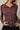 Close-up of burgundy Mock Neck Long Sleeve Button Up Top with button-up front