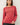 Model wearing red raglan sleeve slub pullover sweater, front view
