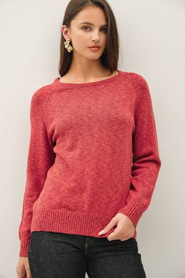 Model wearing red raglan sleeve slub pullover sweater, front view