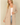 Shop Wall beige long sleeve open front cardigan with side pockets worn by a smiling woman
