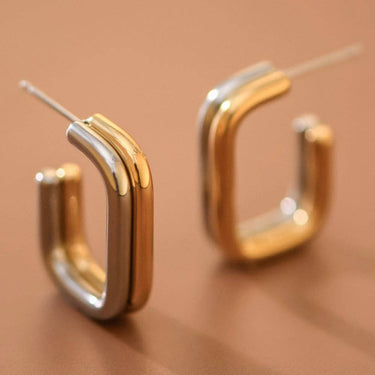 18K Gold PVD Plated Waterproof Stainless Steel Hoop Earrings 7782 displayed as a pair on a warm brown background