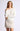 Model wearing Chiara long-sleeve pullover sweater in white