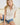 White collared V neck button down line lace detail shirt with blue denim shorts