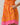 Model showcasing the Donna Dot Elanie Button Down Mini Dress with pockets in vibrant orange pink color.