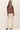 Model wearing dusty mauve Ultra Soft Boatneck Basic Long Sleeve Top with cream pants