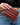 Jocelyn Wallet Chocolate with quilted texture held in hand.