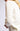 Close-up detail of Chiara white long-sleeve pullover sweater fabric