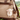 Felt Mini Sheep Keychain hanging from a stylish backpack, showcasing its cute design and handmade quality.