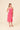 Model wearing a Two Tone Floral Button-Down Bodice Midi Dress, showcasing a floral design and adjustable straps.