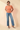 Round Neck Cable Sweater full-length view with blue jeans