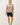 Model wearing stone cotton modal fleece sweatshirt with black shorts, front view