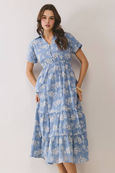 Embroidered Floral Tiered Button Down Midi Dress displayed on a model with a blue floral design and tiered skirt.