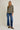 Full-length view of model wearing olive green Round Neck 3-4 Sleeve Top with blue jeans