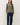Close-up of sage green raglan sleeve slub pullover sweater fabric and neckline