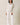 Full-length view of model wearing beige melange Half Zip Funnel Neck Long Sleeve Pullover Top with matching pants