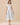 Floral Print Zipper Front Midi Dress worn by a model with a V neckline and cap sleeves on a neutral background.