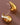 18K Gold Plated Waterproof Stainless Steel Stud Earrings 7080 displayed against a brown background