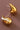18K Gold Plated Waterproof Stainless Steel Stud Earrings 7080 displayed against a brown background