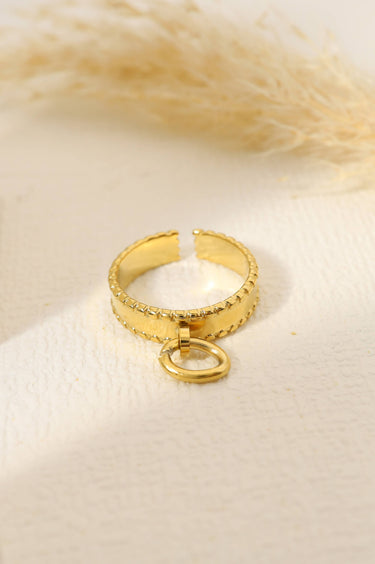 Golden ring with a pendant