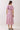 Back view of the Pink Tropical Print Puff Sleeve Midi Dress with puff sleeves and smocked bodice.