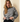 Round neck long-sleeve stripe sweater on model, showcasing a striped pattern and relaxed fit.