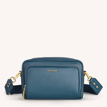 Mira & Moss Lucienne Crossbody Bag in blue vegan leather with gold-tone hardware and structured design.