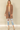 Shop Wall brown open front cardigan with long sleeves and side pockets worn by a blonde model with ripped jeans