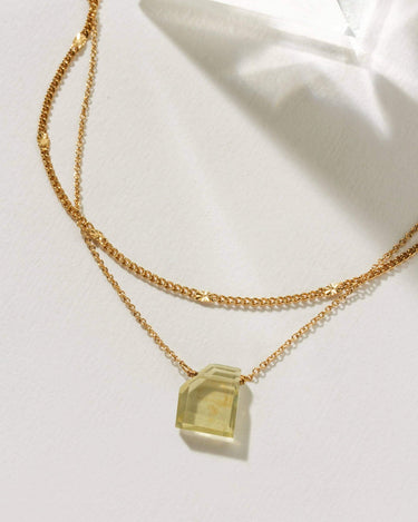 Aura Slice Gemstone Necklace - Limon Quartz featuring a shimmering chain and freeform Limon Quartz pendant.