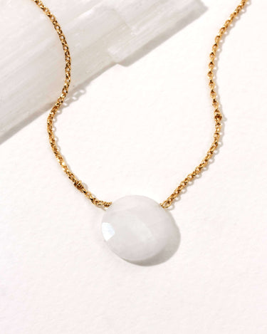Gem in the Moon Gemstone Necklace- Moonstone featuring a circular moonstone pendant on a gold-plated chain.