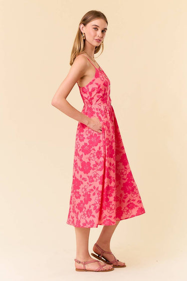 Model wearing a Two Tone Floral Button-Down Bodice Midi Dress with adjustable straps and side pockets.