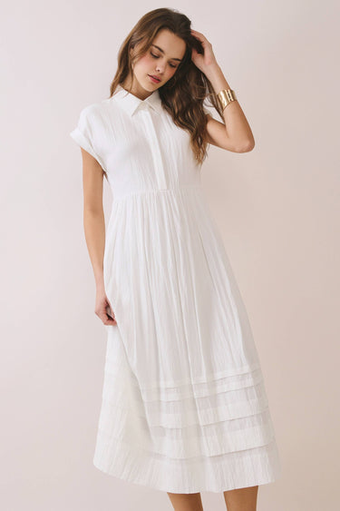 Classic Shirt Collar Neck Pleated Detail Dress worn by a model, showcasing a midi length and pleated hem detail.