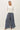 Full-length view of model wearing white Ultra Soft Essential Basic Crewneck Button Up Cardigan