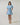 Model wearing Gabriella Denim Fray Mini Dress in light denim, front view