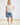 White collared V neck button down line lace detail shirt with blue denim shorts